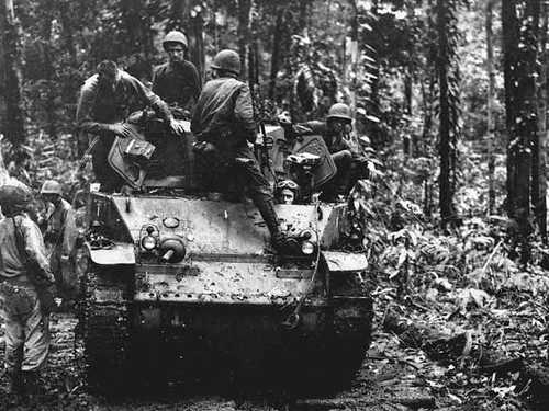 US Marines sitting atop a M3 light tank