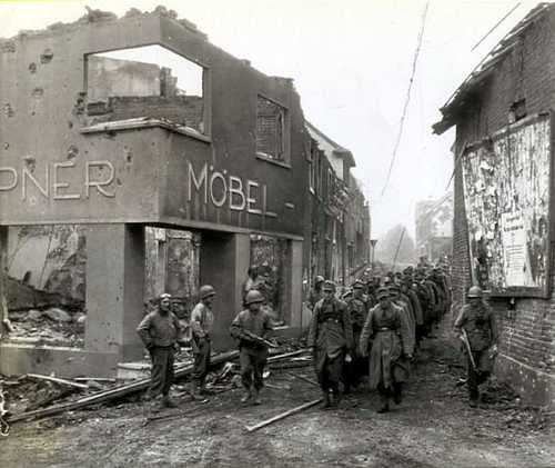 POWs march into town