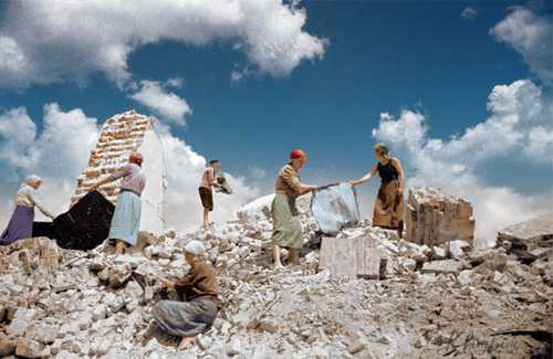 Soviet women clearing away the debris