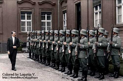 Adolf Hitler in frake in front of the guards chang