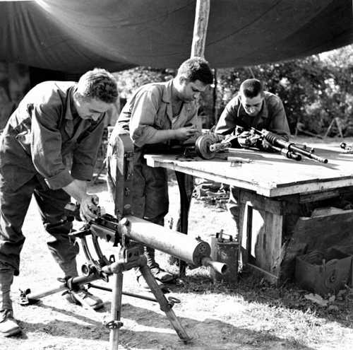 Examine captured weapons