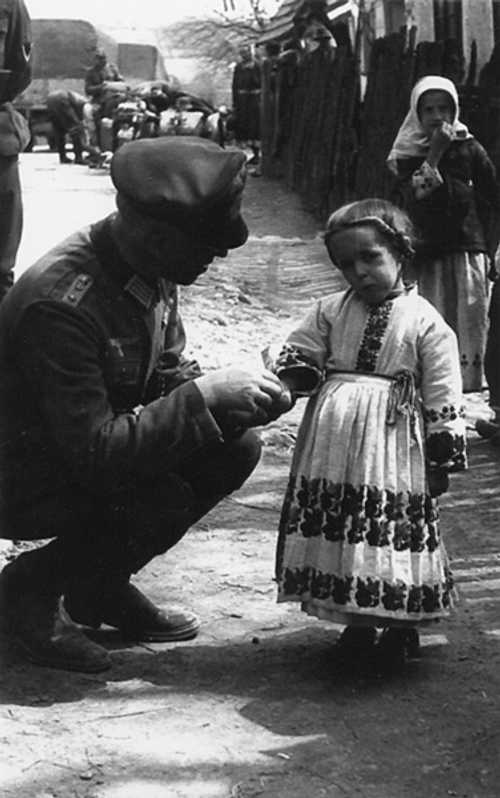 German officer greets little Russian Girl