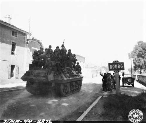 GIs riding on tank destroyer