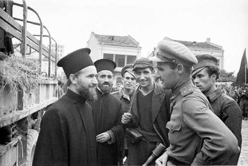 Soviet officer talks with Bulgarian priests.