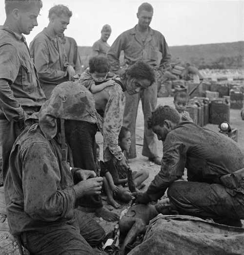 Marines aiding injured child