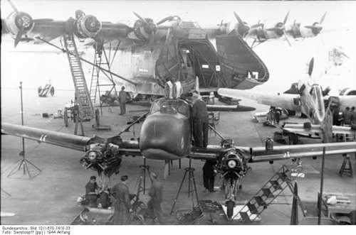 Planes under repair and Me 323 Gigant.