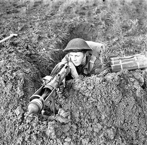 Private Ed Arsenault with a Piat anti-tank weapon