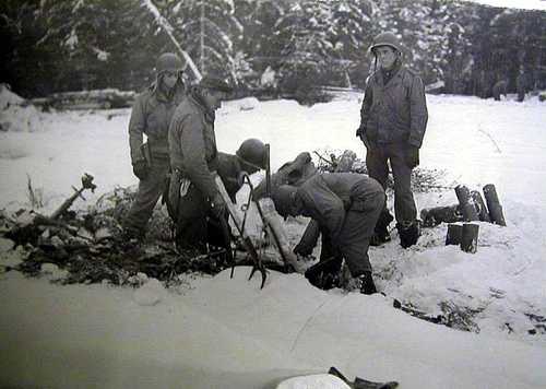 First Army soldiers dig in the snow