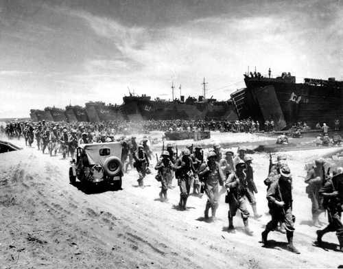 Marines march ashore Cape Gloucester 