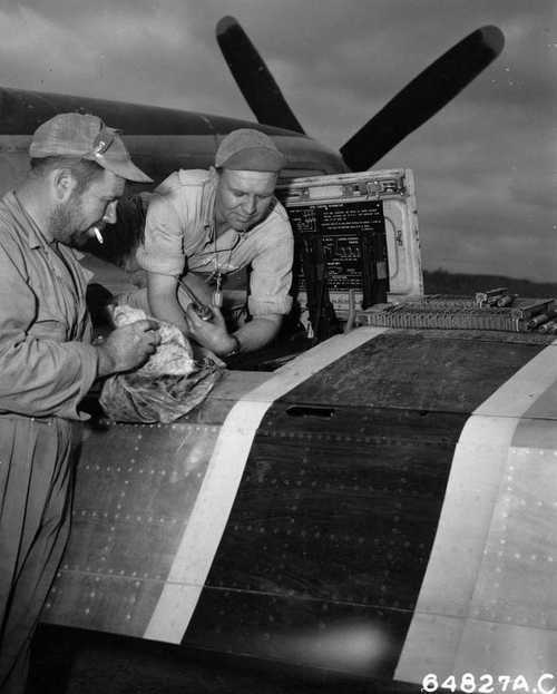 Armorers working on .50 cal machine gun