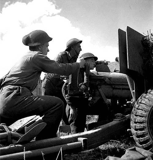 Canadians man an anti-tank gun