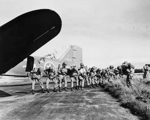US Paratroopers checking chutes