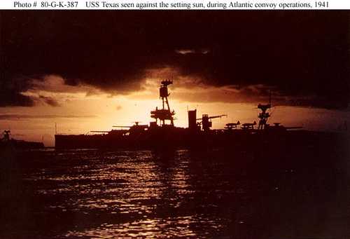 USS Texas seen against the setting sun