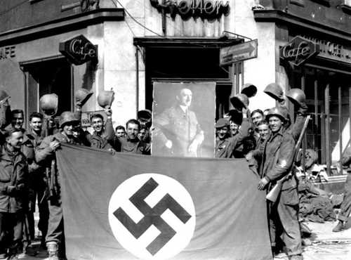 Posing with flag and portrait