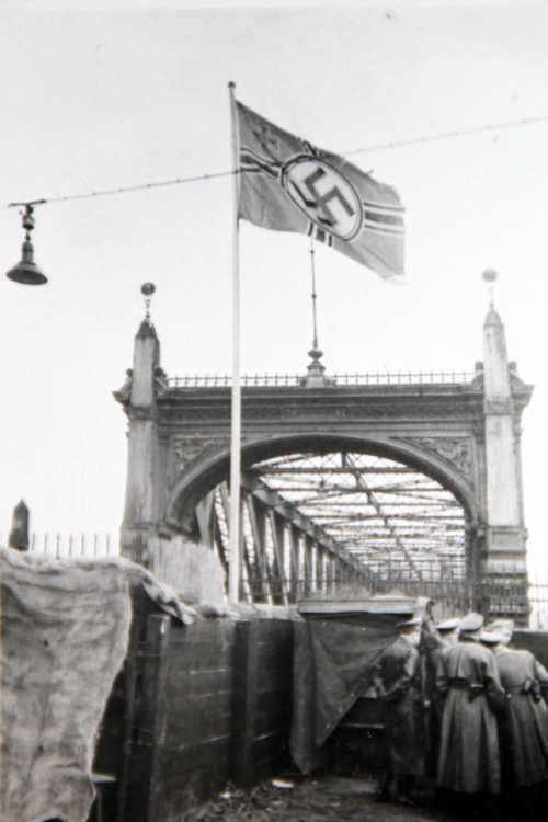 Geman soldiers on bridge. 