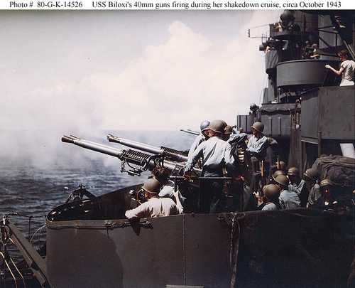USS Biloxi's 40mm guns firing during her shakedown cruise