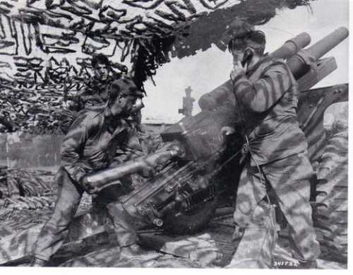 A 105mm howtizer crew preparing to fire