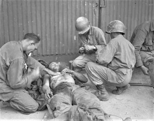 Treat a wounded soldier
