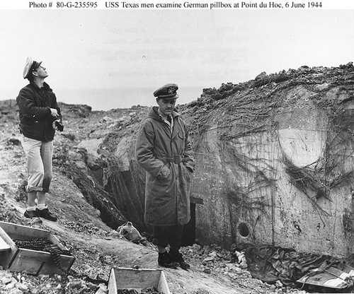Examining a damaged German pillbox