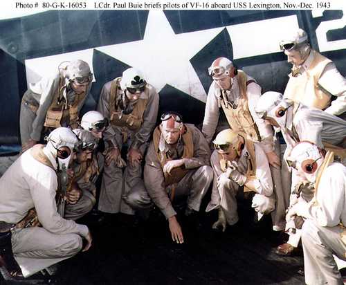 LCdr Paul Buie briefs pilots aboard USS Lexington
