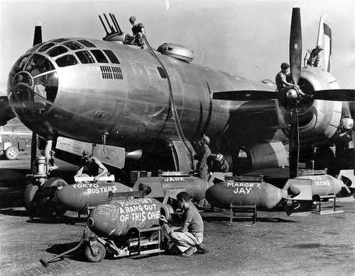 Bombs are loaded into a B-29